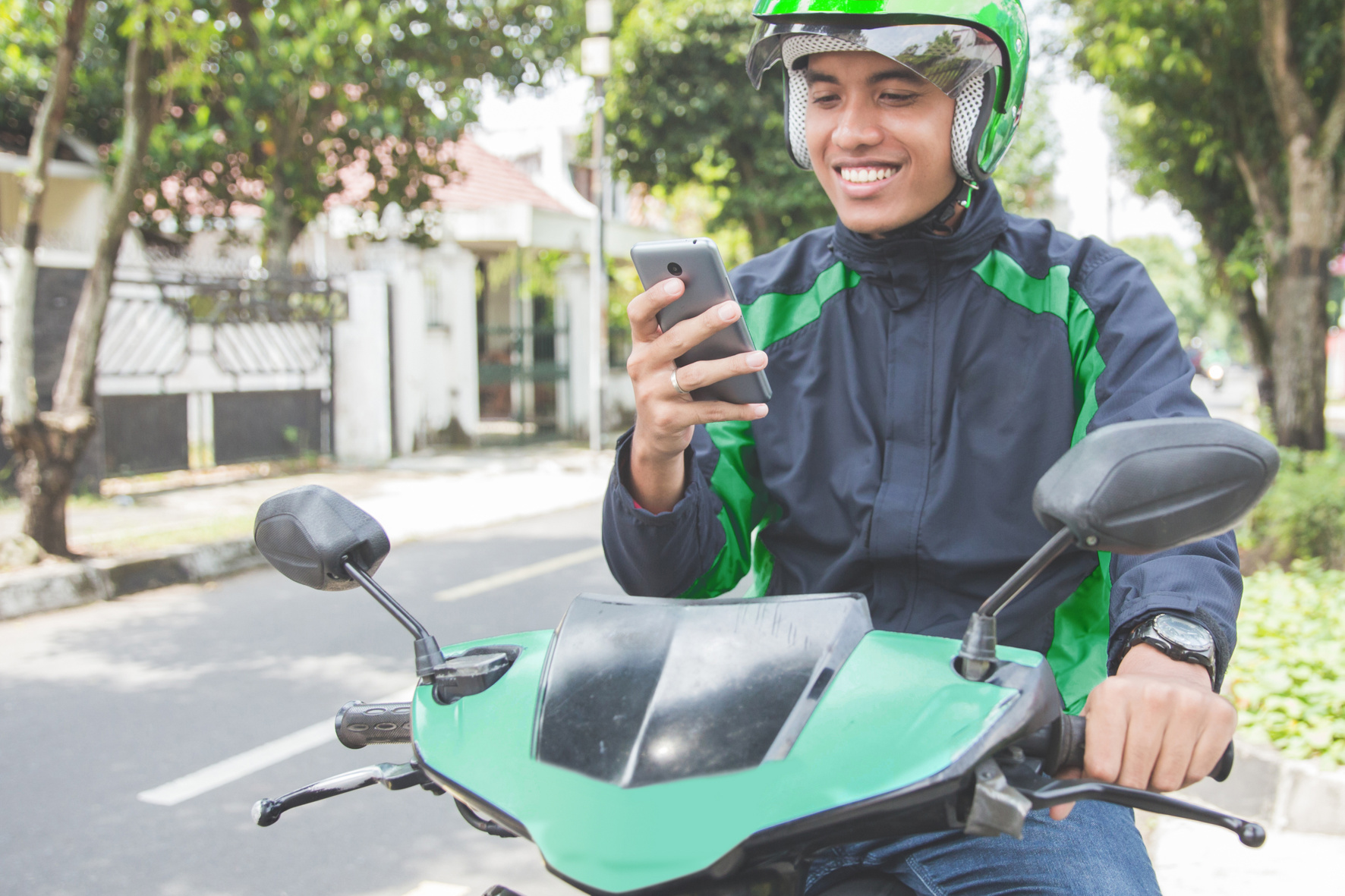 Motorcycle Taxi Driver Taking Order 